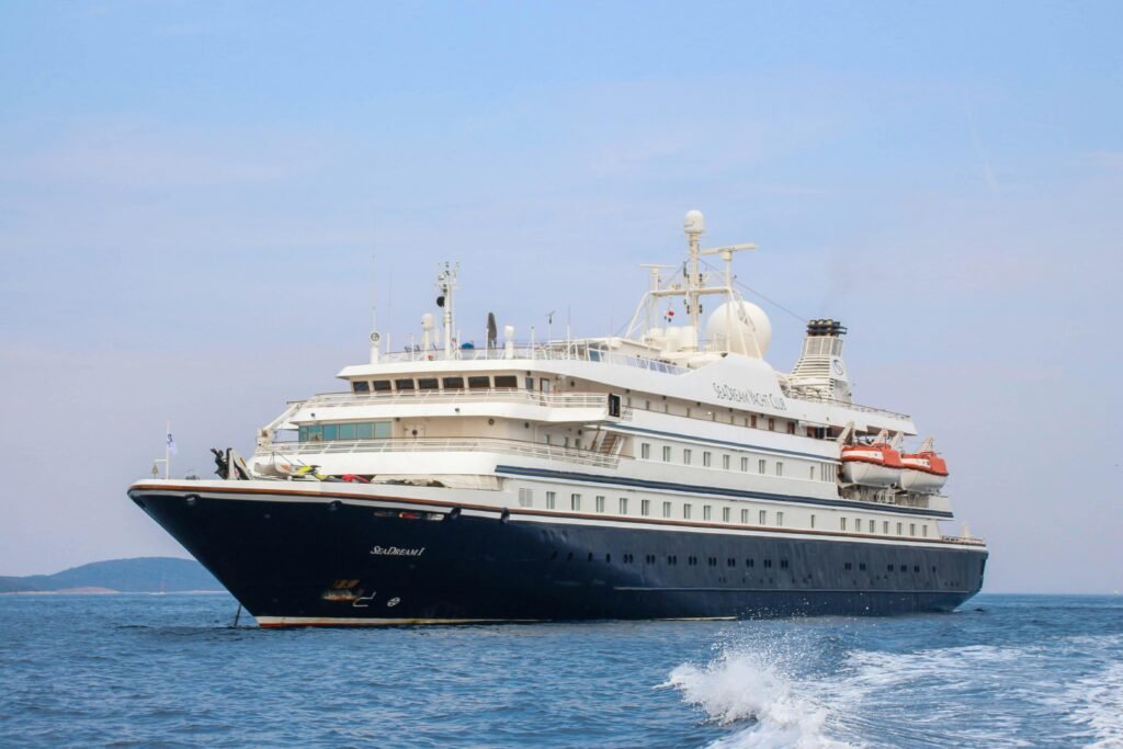 Discover the elegance of a luxurious cruise ship sailing on the open sea, ideal for adventure and relaxation.